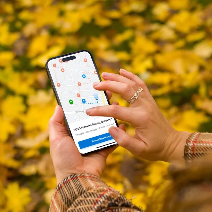 FieldEdge field organizing app shown on a mobile phone over a campaign-rally backdrop